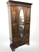 A late Victorian mahogany and satinwood inlaid mirror door wardrobe, 99 cm x 45 cm x 199 cm.