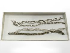 Four silver decorative bracelets. CONDITION REPORT: 22.3g.