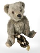 A vintage jointed mohair teddy bear, height 27 cm, and a small Steiff monkey.