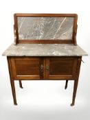 A late Victorian satinwood inlaid and marble topped wash stand,