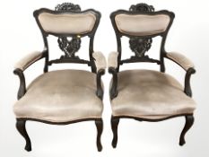 A pair of 20th century mahogany salon armchairs in peach draylon.