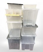 A group of plastic storage boxes with lids, largest 42 cm high.