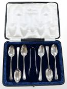A set of six silver teaspoons with tongs. CONDITION REPORT: 120.1g.