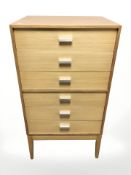 A 20th century teak six drawer chest,