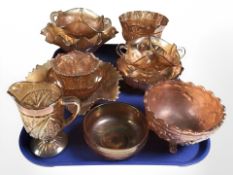 Eleven pieces of carnival glass.