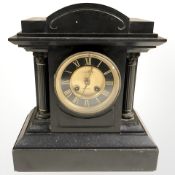 A Victorian black slate eight day mantel clock with enameled dial,