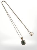 A 9ct yellow gold emerald and diamond cluster pendant on chain