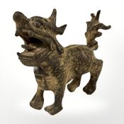 A Chinese bronze figure of a temple dog, length 13 cm.