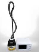 A Zanussi vacuum and a microwave.