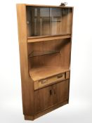 A G-Plan teak corner cabinet.