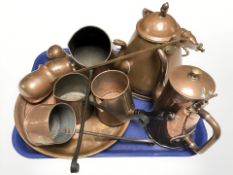 A group of copper measures, teapots, etc.