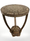 An early 20th century Damascus mother of pearl and bone-inlaid circular occasional table,