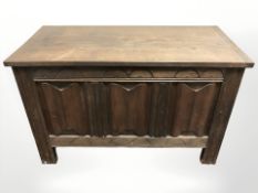 An oak linen fold blanket box, 95 cm x 45 cm x 60 cm.