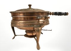 An Islamic copper plated food warming vessel on burner stand, height 24 cm.