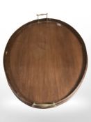 A late Victorian mahogany oval serving tray with brass handles,