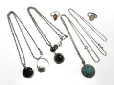 A group of silver jewellery to include three pendants on chains,
