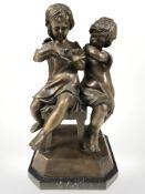 An Art Deco style bronze figure of two children, after Joseph D'Aste, height 34 cm.