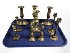 Ten pairs of brass candlesticks, including a pair modelled as herons, height 18 cm.