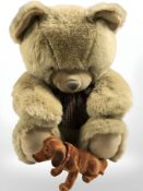 A large jointed teddy bear and a nodding dog figure, teddy 59 cm tall.