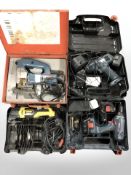 A group of boxed power tools including Bosch jigsaw, Stanley angle grinder, Black & Decker drill,