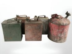 Four two gallon petrol cans and a red enameled paraffin can.