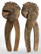 Two carved beech nutcrackers, length 20 cm.