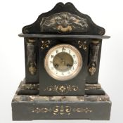 A Victorian black slate and marble eight day mantel clock with enameled dial, height 38 cm.