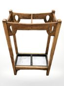 An Arts & Crafts oak stick stand,