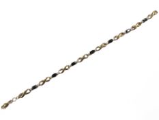 A 9ct yellow gold diamond and sapphire bracelet, length 18 cm CONDITION REPORT: 5.6g.