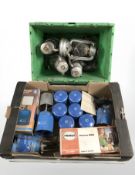 A group of storm lights, camping lights and stoves, various gas cans.