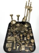 A group of miniature brass ornaments, money box, candlesticks, fire companion set, letter rack, etc.