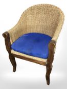 A 20th century wooden-framed wicker armchair and a further pair of chairs (3)