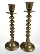 A pair of Victorian brass knopped stem candlesticks, height 24 cm, and a further chrome pair.
