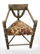 A carved oak turners armchair, together with three elm farmhouse spindle back chairs.