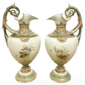A pair of Royal Worcester hand painted gilded urns, shape No. 1309, height 25.5 cm.