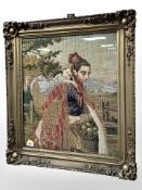 A 19th century needlework panel depicting mother carrying a child, in ornate gilt frame,