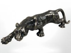 A cast metal panther figure.