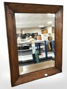 A 19th century oak bevelled mirror, 49 cm x 64 cm.