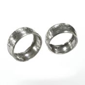 Two silver rings each formed from a half crown coin.