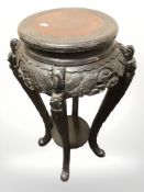A late 19th century Chinese hardwood jardiniere stand,