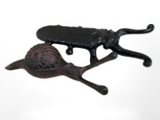 A Victorian style beetle boot jack together with a snail.