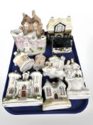 A group of Staffordshire ware including flat back figures, houses and other ornaments.