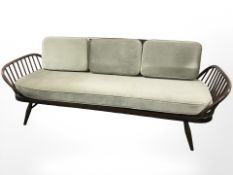 An Ercol stained elm day bed,