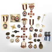 A group of badges including St Johns, WWII period, etc.