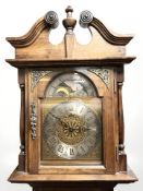 A good quality longcase clock with brass and silvered moon phase dial,