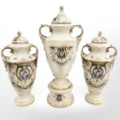 An antique three piece gilded vase trio.