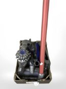 A Dyson hand-held cordless vacuum cleaner.