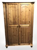 A pine double door wardrobe,