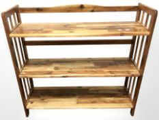An Indonesian hardwood open bookcase of three shelves, width 95 cm, height 91 cm.