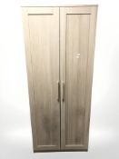 A John Lewis four-piece light oak bedroom suite comprising af double-door wardrobe, width 78 cm,